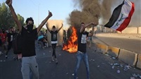 3 Iraqi protesters