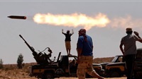 Libya caught between
